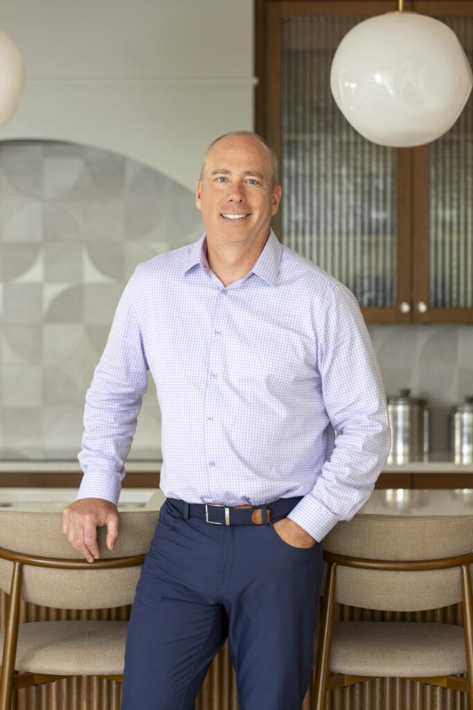 Chris McGuire, Production Director, Vujovich Design Build, In a kitchen home setting.