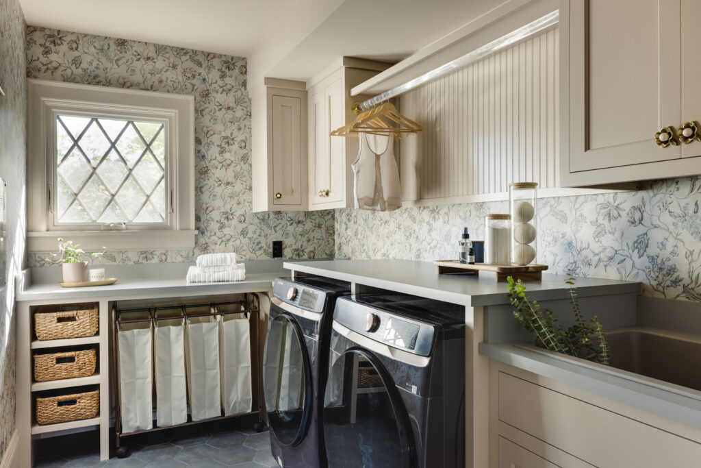 Laundry room with cheerful floral wallpaper