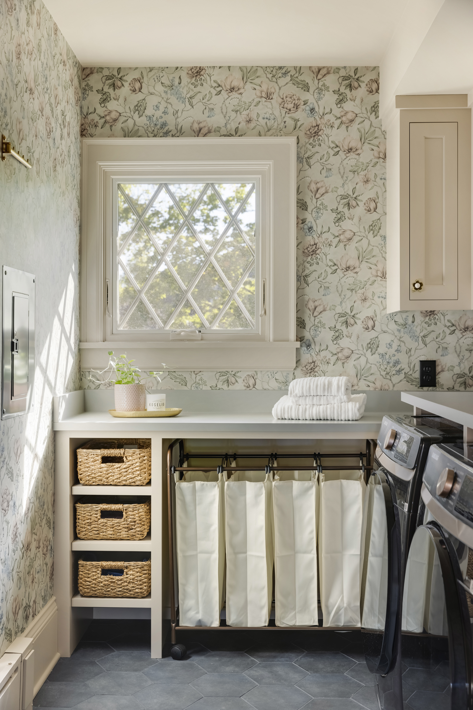 Floral wallcoverings bring life to a Minneapolis laundry room